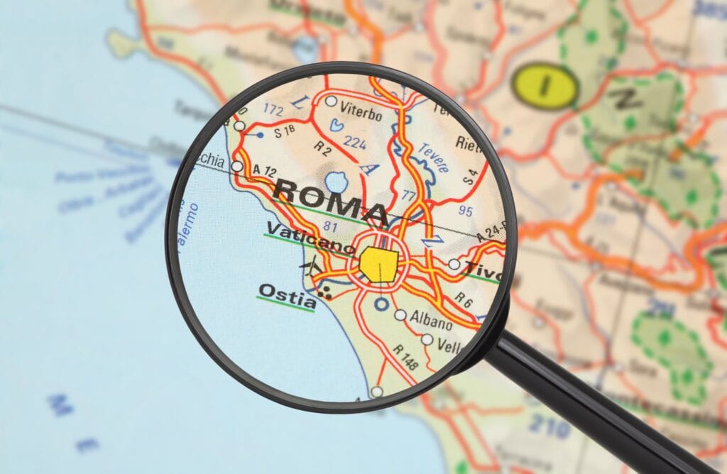 Tourist conceptual image. Destination - Roma (with magnifying glass)